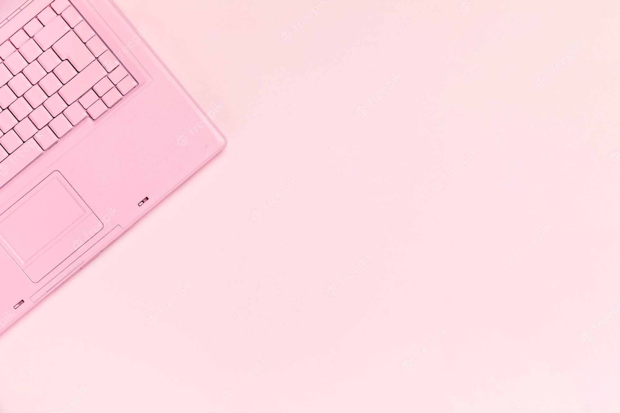 A pink laptop on a pink background - Pink