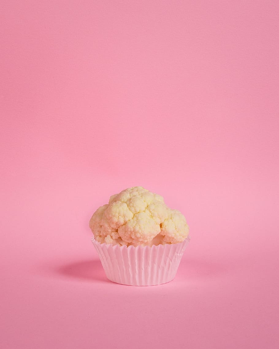 A head of cauliflower in a cupcake holder against a pink background - Cupcakes, pink