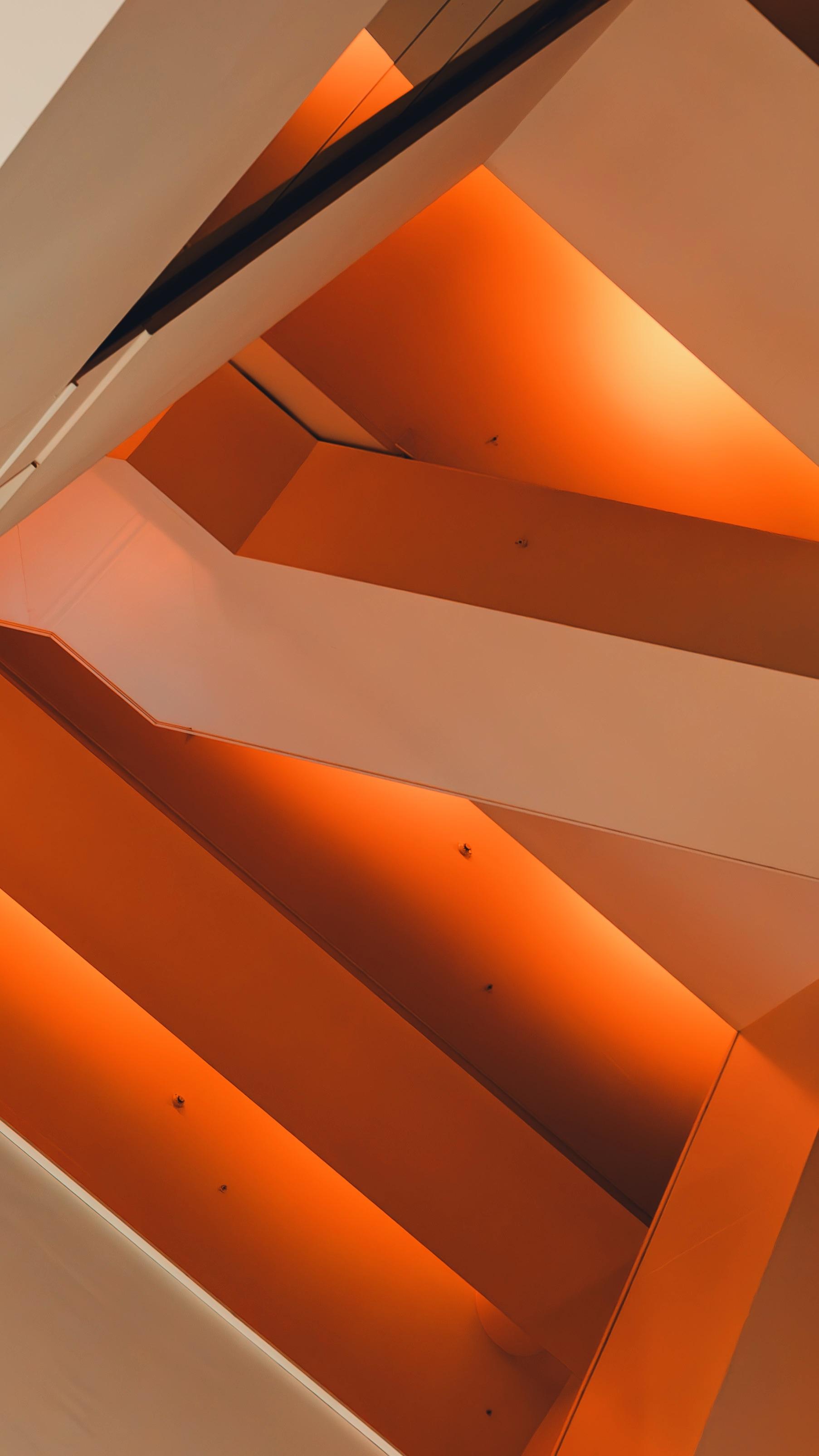 A bright orange staircase with lights on. - Neon orange