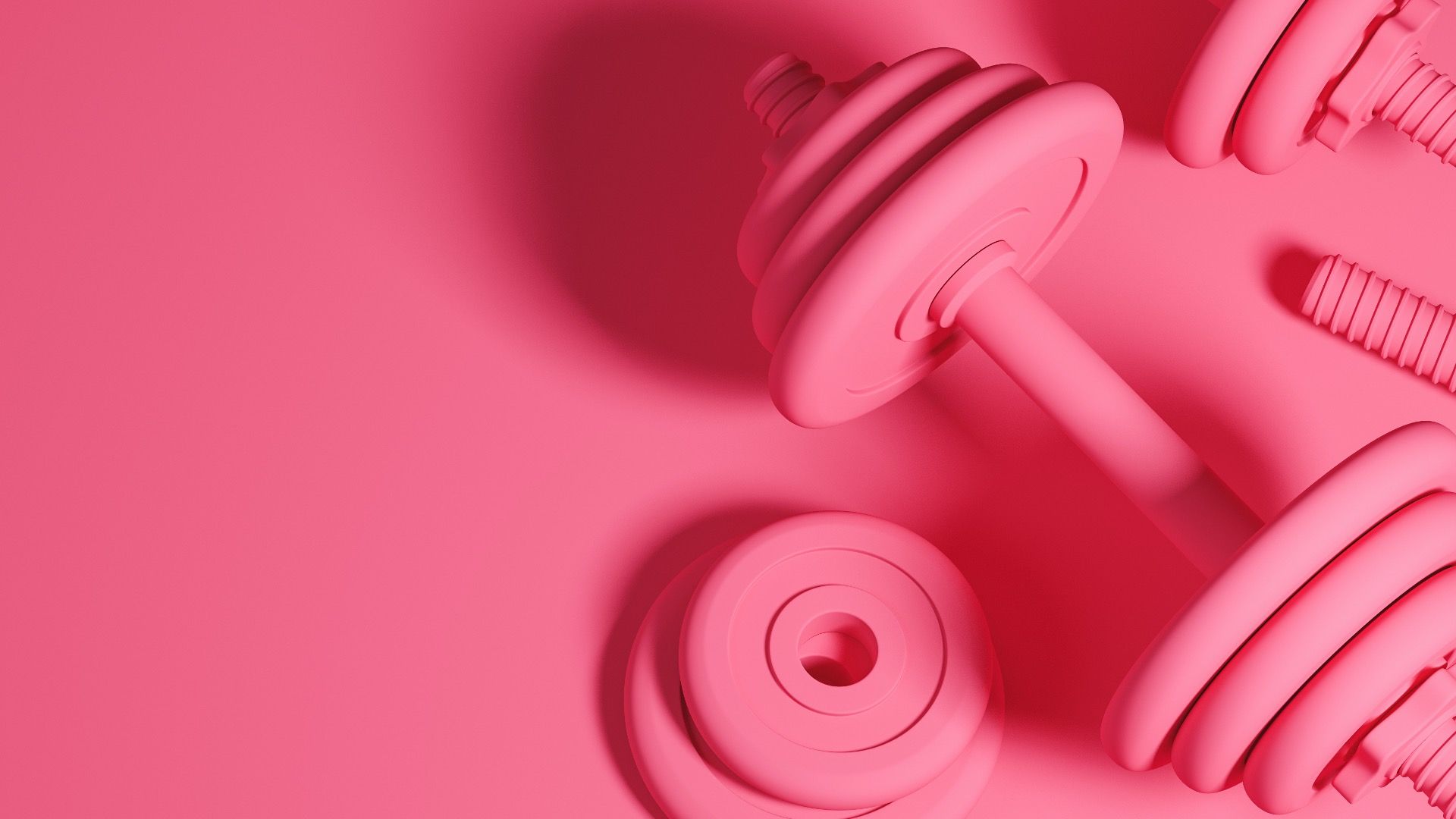A pair of pink weights on a pink background - Pink