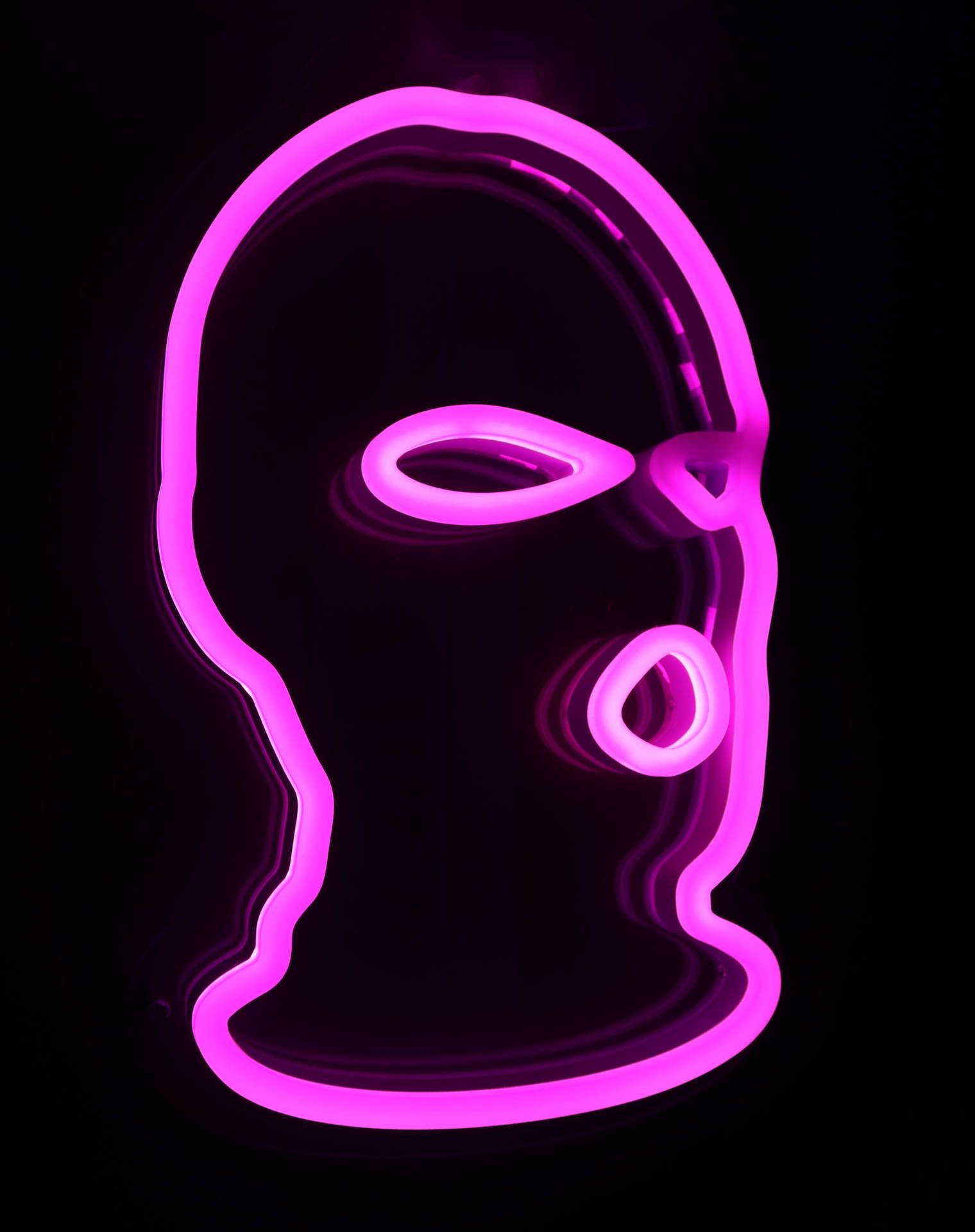 A pink neon light of a ski mask on a black background. - Purple